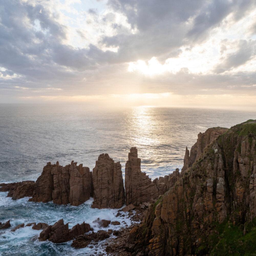 a rocky coastline in the morning sun